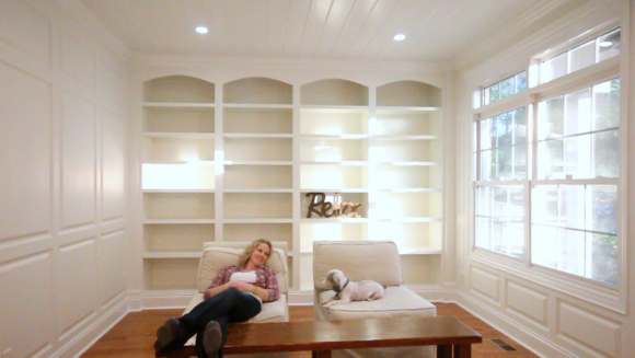 Library with white built ins and wainscoting